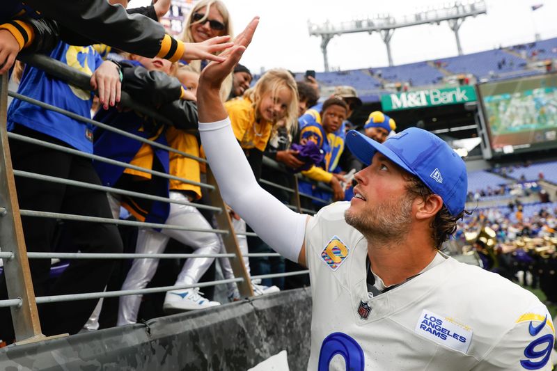 Oct 12, 2025; Baltimore, Maryland, USA; Los Angeles Rams quarterback Matthew Stafford (9) greets his family after the game against the Baltimore Ravens at M&T Bank Stadium. Mandatory Credit: Peter Casey-Imagn Images