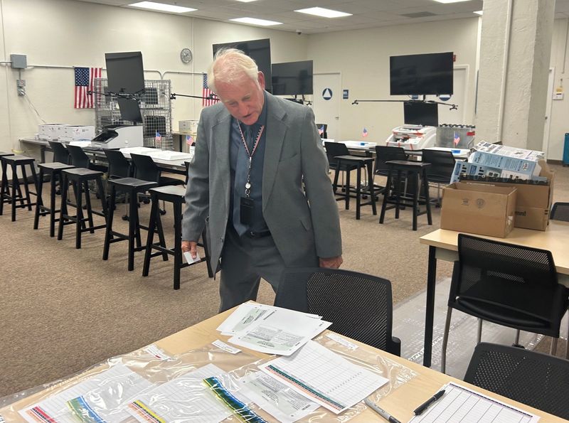 Shasta County Clerk and Registrar of Voters Clint Curtis looks over training materials inside the elections office in downtown Redding.