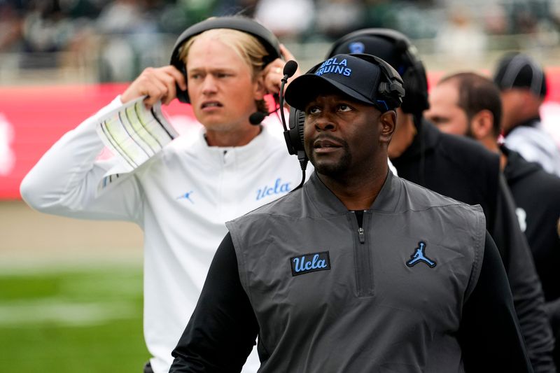 Oct 11, 2025; East Lansing, Michigan, USA; UCLA Bruins interim head coach Tim Skipper looks up at the video board in the fourth quarter at Spartan Stadium. Mandatory Credit: Brendan Mullin-Imagn Images