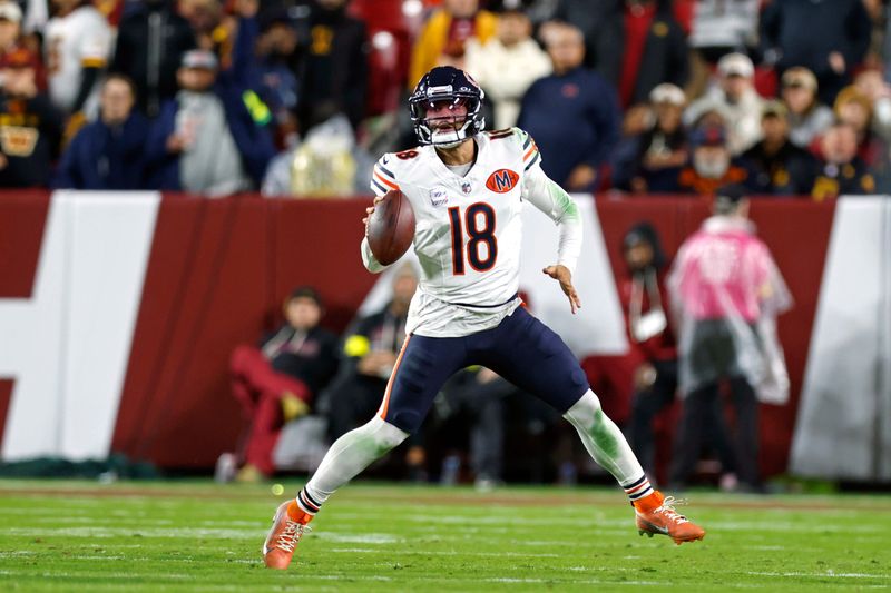 Oct 13, 2025; Landover, Maryland, USA; Chicago Bears quarterback Caleb Williams (18) looks to pass the ball against the Washington Commanders during the second quarter at Northwest Stadium. Mandatory Credit: Peter Casey-Imagn Images
