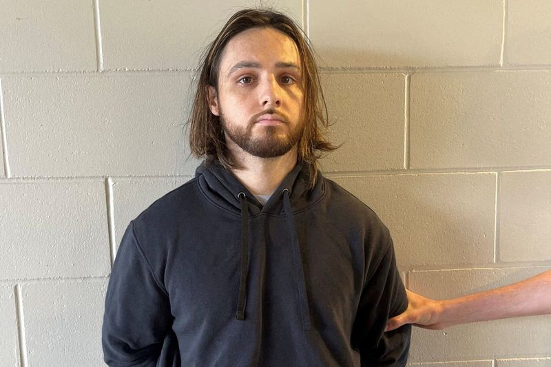 Jonathan Rinderknecht, 29, is pictured after his arrest on charges that he intentionally ignited the Pacific Palisades Fire.