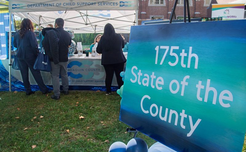 People visit various county agencies at the State of the County and San Joaquin County 175th anniversary event on the University of the Pacific campus in Stockton on Oct. 16, 2025.