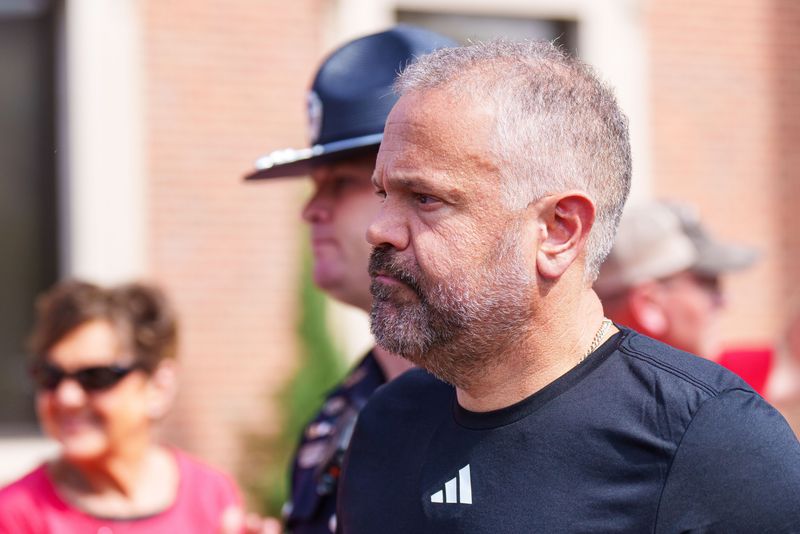 Sep 20, 2025; Lincoln, Nebraska, USA; Nebraska Cornhuskers head coach Matt Rhule walks into the facilities before the game against the Michigan Wolverines at Memorial Stadium. Mandatory Credit: Dylan Widger-Imagn Images