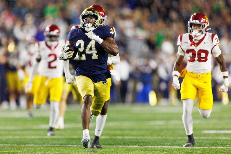 Notre Dame running back Jadarian Price (24) returns a kick for a touchdown in the second half of a NCAA football game against Southern California at Notre Dame Stadium on Saturday, Oct. 18, 2025, in South Bend.