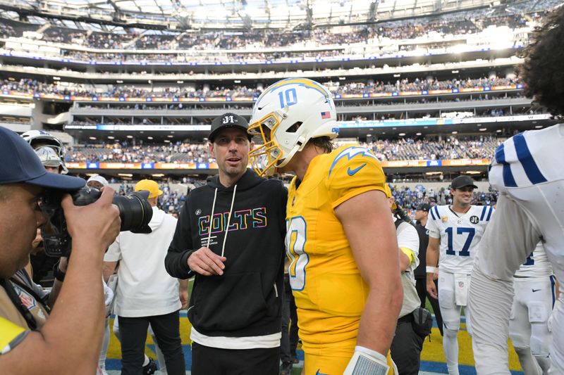 Oct 19, 2025; Inglewood, California, USA; Indianapolis Colts head coach Shane Steichen hugs Los Angeles Chargers quarterback Justin Herbert (10) after the game at SoFi Stadium. Mandatory Credit: Jayne Kamin-Oncea-Imagn Images