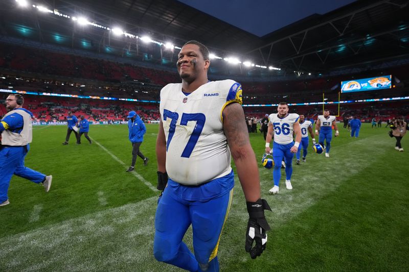 Oct 19, 2025; London, United Kingdom; Los Angeles Rams offensive tackle Alaric Jackson (77) leaves the field after a NFL International Series game against the Jacksonville Jaguars at Wembley Stadium. Mandatory Credit: Kirby Lee-Imagn Images