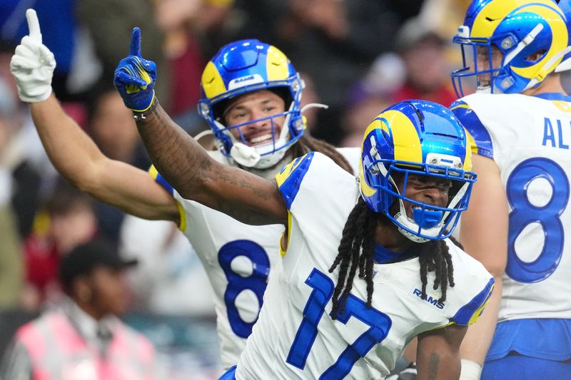 Oct 19, 2025; London, United Kingdom; Los Angeles Rams wide receiver Davante Adams (17) celebrates with wide receiver Jordan Whittington (88) after scoring a touchdown against the Jacksonville Jaguars during the first half of an NFL International Series game at Wembley Stadium. Mandatory Credit: Kirby Lee-Imagn Images