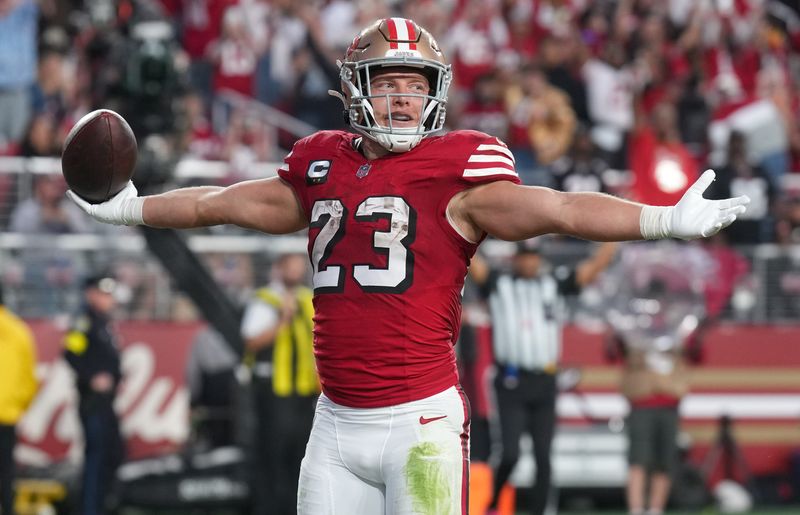 Oct 19, 2025; Santa Clara, California, USA; San Francisco 49ers running back Christian McCaffrey (23) celebrates after a touchdown during the second quarter against the Atlanta Falcons at Levi's Stadium. Mandatory Credit: Kyle Terada-Imagn Images