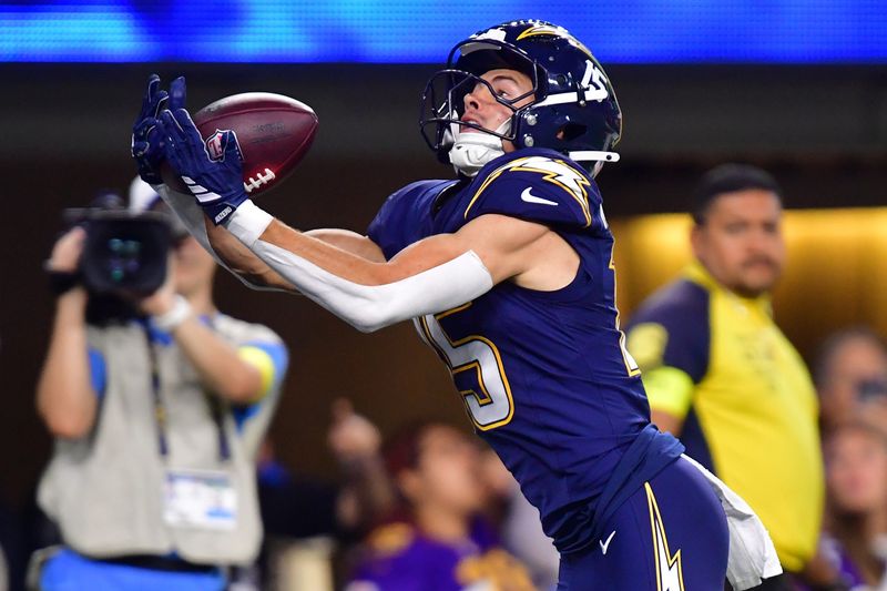 Oct 23, 2025; Inglewood, California, USA; Los Angeles Chargers wide receiver Ladd McConkey (15) makes a touchdown catch against the Minnesota Vikings during the first half at SoFi Stadium. Mandatory Credit: Gary A. Vasquez-Imagn Images