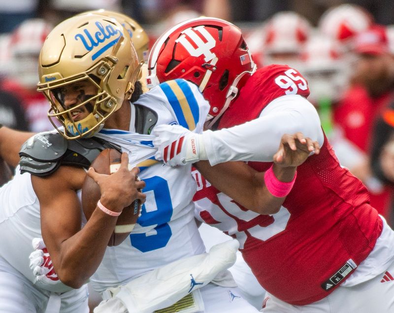 Indiana's Tyrique Tucker (95) sacks UCLA's Nico Iamaleava (9) during the Indiana versus UCLA football game at Memorial Stadium on Saturday, Oct. 25, 2025.