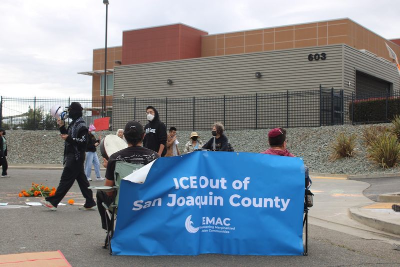 Demonstrators gather Sunday, Oct. 26, 2025, outside the U.S. Immigration and Customs Enforcement (ICE) facility in Stockton after immigrant advocates reported unexpected weekend check-ins that prompted confusion and fear among families.