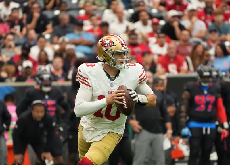 Oct 26, 2025; Houston, Texas, USA; San Francisco 49ers quarterback Mac Jones (10) throws downfield during the first quarter against the Houston Texans at NRG Stadium. Mandatory Credit: Sean Thomas-Imagn Images