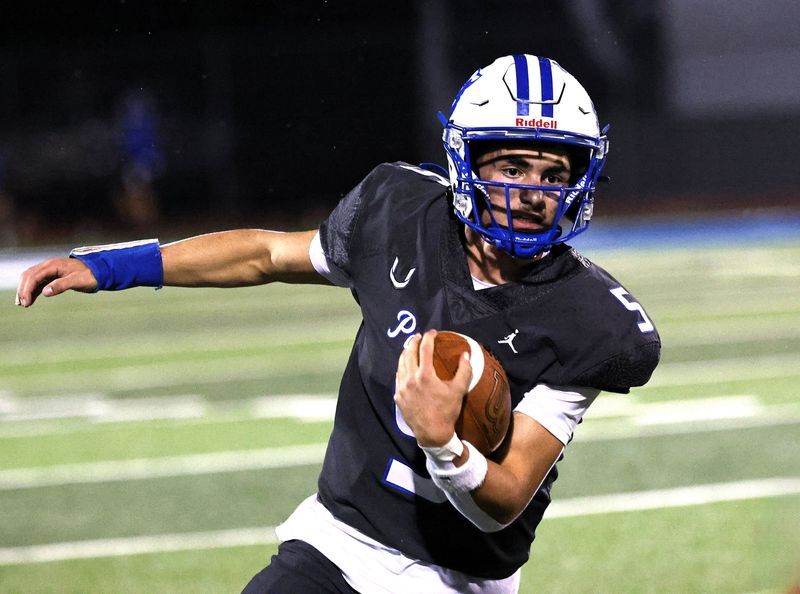 U-Prep quarterback Talis Payne carries the ball in the first half against Anderson on Friday, Oct. 24, 2025. U-Prep came away with a 32-6 homecoming victory over Anderson.