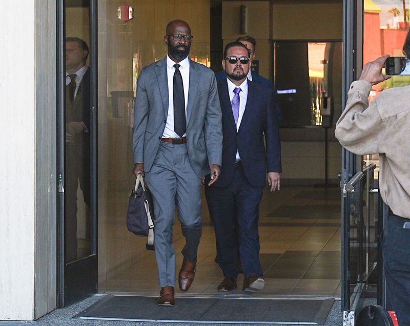 Coachella Mayor Steven Hernandez, right, exits the Indio courthouse with his attorney after his indictment in 2025.