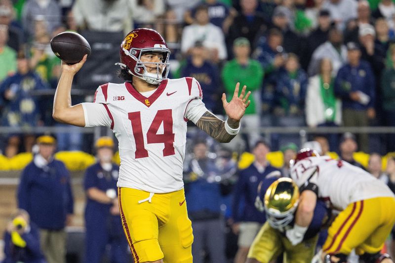 Oct 18, 2025; South Bend, Indiana, USA; Southern California Trojans quarterback Jayden Maiava (14) drops back to throw the ball in the first half against the Notre Dame Fighting Irish at Notre Dame Stadium. Mandatory Credit: Trevor Ruszkowski-Imagn Images