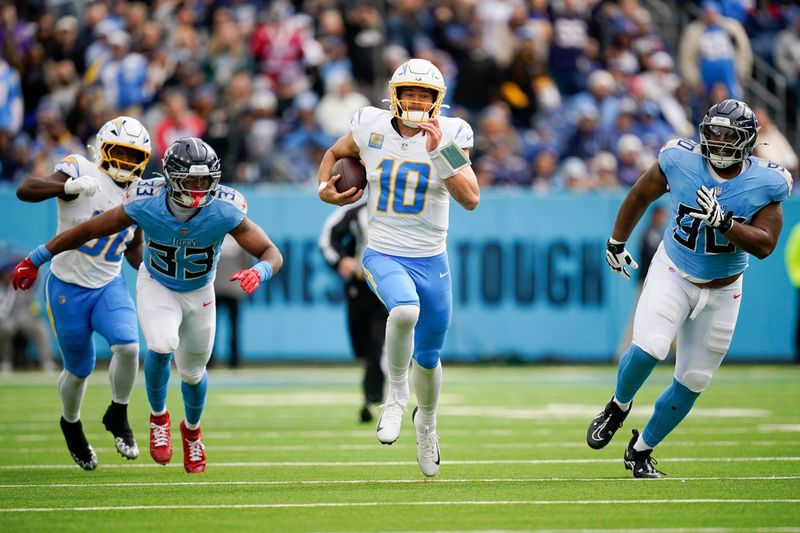 Los Angeles Chargers quarterback Justin Herbert (10) runs the ball against the Tennessee Titans during the second quarter at Nissan Stadium in Nashville, Tenn., Sunday, Nov. 2, 2025.