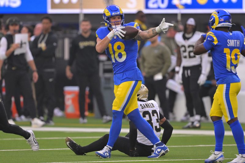 Nov 2, 2025; Inglewood, California, USA; Los Angeles Rams tight end Terrance Ferguson (18) reacts after making a 45-yard reception against the New Orleans Saints during the first half at SoFi Stadium. Mandatory Credit: Jayne Kamin-Oncea-Imagn Images