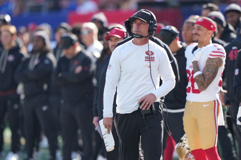 Nov 2, 2025; East Rutherford, New Jersey, USA; San Francisco 49ers head coach Kyle Shanahan looks on from the sidelines against the New York Giants during the first half at MetLife Stadium. Mandatory Credit: Robert Deutsch-Imagn Images
