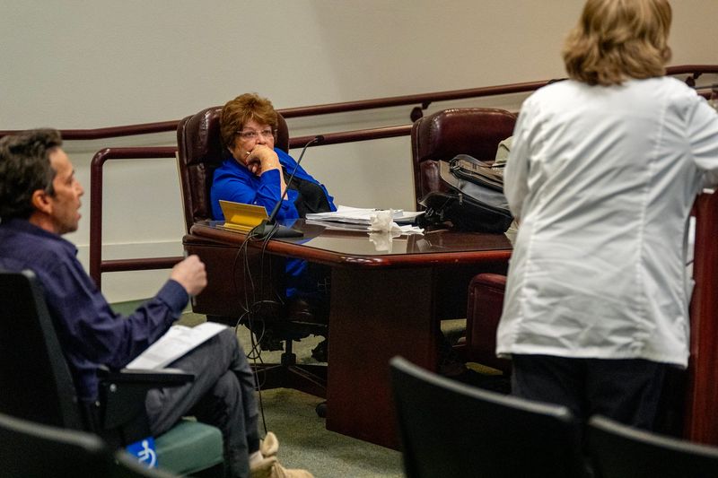 Palo Verde Hospital CEO Sandra Anaya, center, listens as two medical professionals at Palo Verde Hospital disagree during a Palo Verde Hospital District Board of Directors meeting in Blythe, Calif., on Oct. 29, 2025.