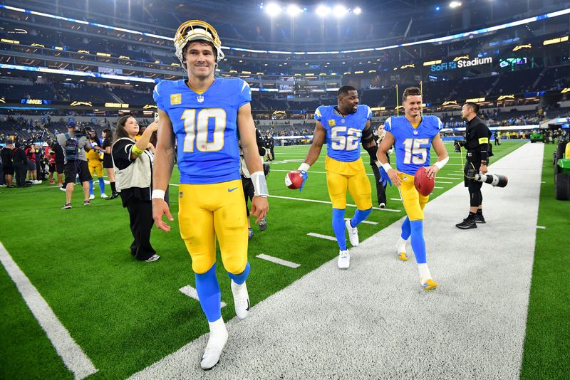 Nov 9, 2025; Inglewood, California, USA; Los Angeles Chargers quarterback Justin Herbert (10), linebacker Khalil Mack (52) and wide receiver Ladd McConkey (15) leave the field after the game against the Pittsburgh Steelers at SoFi Stadium. Mandatory Credit: Gary A. Vasquez-Imagn Images