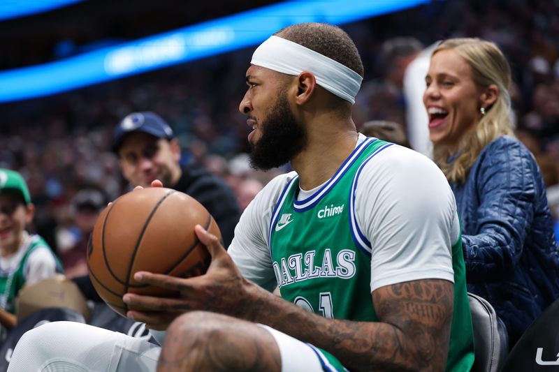 Nov 10, 2025; Dallas, Texas, USA; Dallas Mavericks forward Daniel Gafford (21) sits in a fans seat during the third quarter against the Milwaukee Bucks at American Airlines Center. Mandatory Credit: Kevin Jairaj-Imagn Images