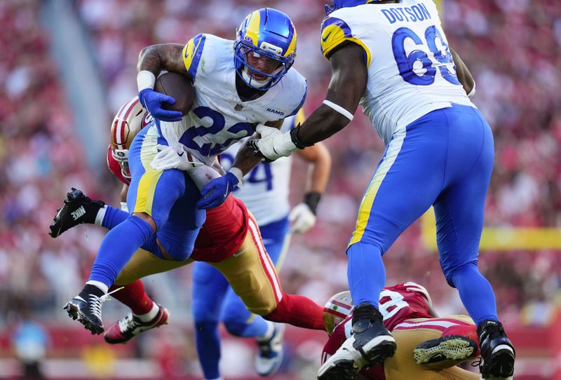 Nov 9, 2025; Santa Clara, California, USA; Los Angeles Rams running back Blake Corum (22) runs the ball during the third quarter against the San Francisco 49ers at Levi's Stadium. Mandatory Credit: Cary Edmondson-Imagn Images