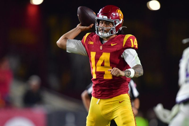Nov 7, 2025; Los Angeles, California, USA; Southern California Trojans quarterback Jayden Maiava (14) throws against the Northwestern Wildcats during the second half at the Los Angeles Memorial Coliseum. Mandatory Credit: Gary A. Vasquez-Imagn Images