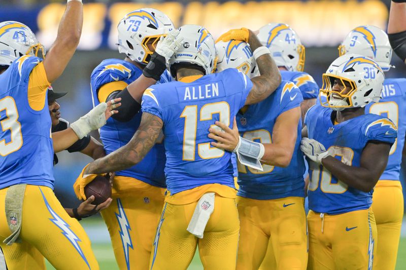 Nov 9, 2025; Inglewood, California, USA; Los Angeles Chargers wide receiver Keenan Allen (13) celebrates with teammates after a reception against the Pittsburgh Steelers during the fourth quarter of the game at SoFi Stadium. Allen set a franchise record for reception with this catch. Mandatory Credit: Jayne Kamin-Oncea-Imagn Images