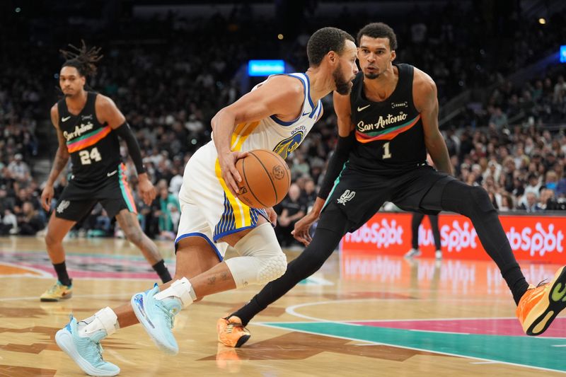 Nov 12, 2025; San Antonio, Texas, USA; Golden State Warriors guard Stephen Curry (30) dribbles against San Antonio Spurs forward Victor Wembanyama (1) in the second half at Frost Bank Center. Mandatory Credit: Daniel Dunn-Imagn Images