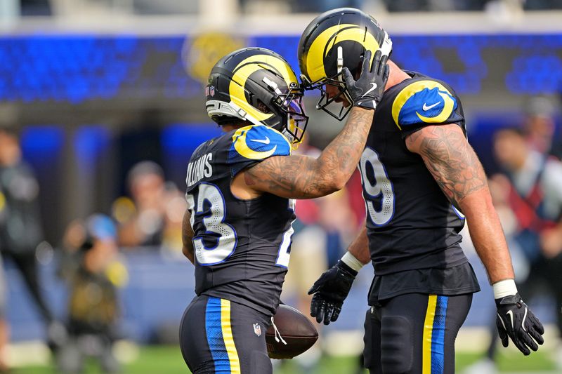 Nov 16, 2025; Inglewood, California, USA; Los Angeles Rams running back Kyren Williams (23) celebrates with tight end Tyler Higbee (89) after scoring a touchdown against the Seattle Seahawks at SoFi Stadium. Mandatory Credit: Jayne Kamin-Oncea-Imagn Images