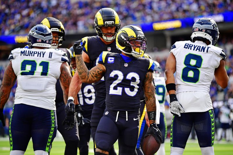 Nov 16, 2025; Inglewood, California, USA; Los Angeles Rams running back Kyren Williams (23) celebrates after running for a touchdown during the first half against the Seattle Seahawks at SoFi Stadium. Mandatory Credit: Gary A. Vasquez-Imagn Images