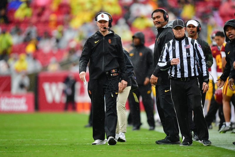 Nov 15, 2025; Los Angeles, California, USA; Southern California Trojans head coach Lincoln Riley watches game action against the Iowa Hawkeyes during the first half at the Los Angeles Memorial Coliseum. Mandatory Credit: Gary A. Vasquez-Imagn Images
