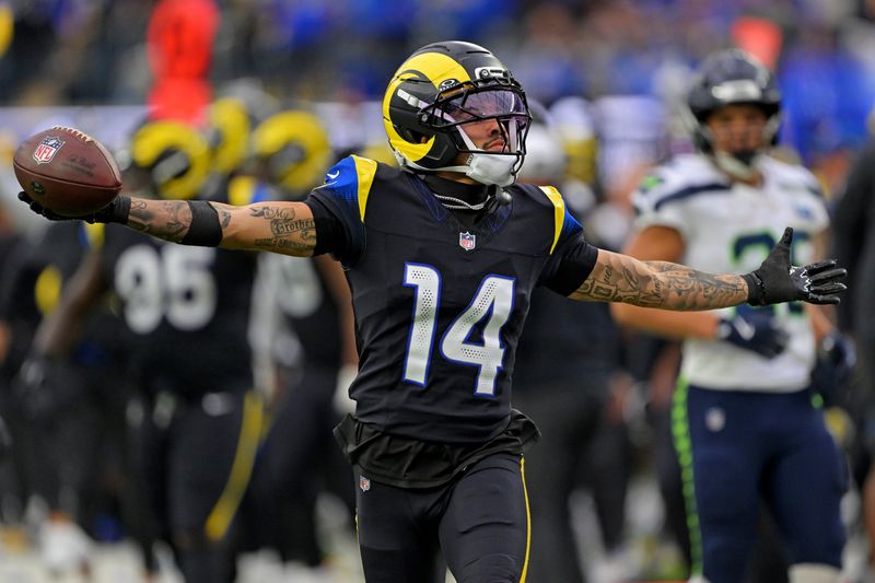 Nov 16, 2025; Inglewood, California, USA; Los Angeles Rams cornerback Cobie Durant (14) celebrates after making an interception during the second half against the Los Angeles Rams at SoFi Stadium. Mandatory Credit: Jayne Kamin-Oncea-Imagn Images