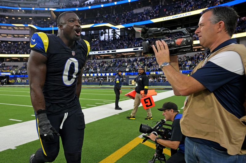 Nov 16, 2025; Inglewood, California, USA; Los Angeles Rams linebacker Byron Young (0) celebrates after beating the Seattle Seahawks at SoFi Stadium. Mandatory Credit: Jayne Kamin-Oncea-Imagn Images