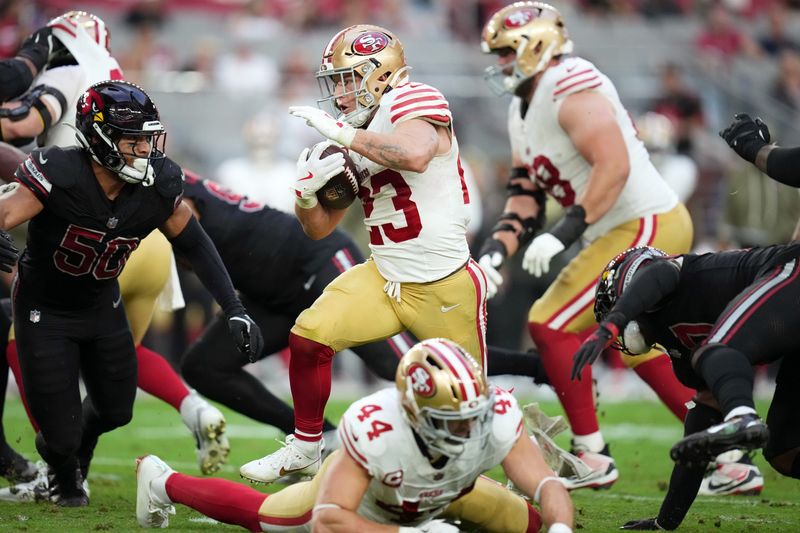 San Francisco 49ers running back Christian McCaffrey (23) breaks out of the backfield against the Arizona Cardinals at State Farm Stadium in Glendale on Nov. 16, 2025.