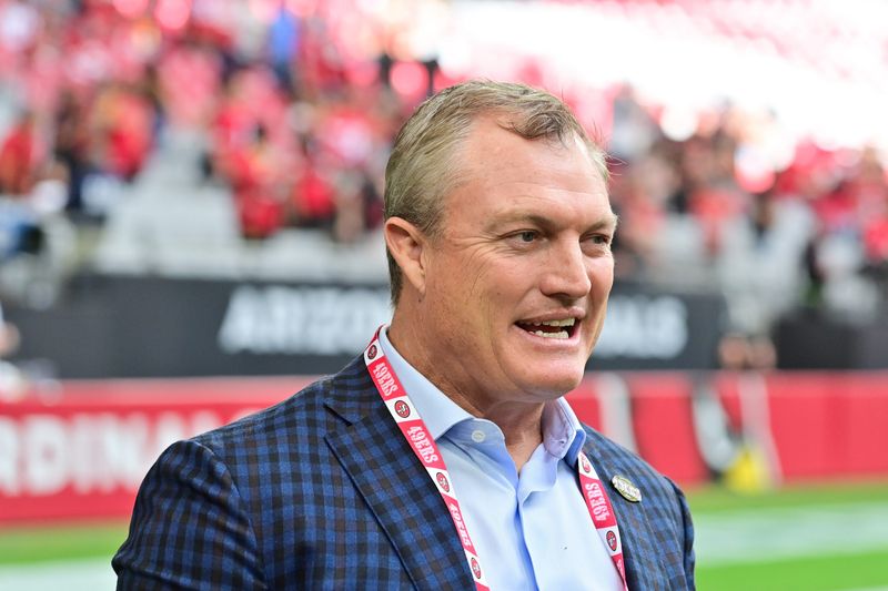 Nov 16, 2025; Glendale, Arizona, USA; San Francisco 49ers general manager John Lynch speaks on the sidelines before the game against the Arizona Cardinals at State Farm Stadium. Mandatory Credit: Matt Kartozian-Imagn Images