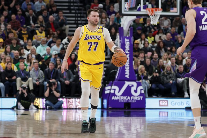 Feb 12, 2025; Salt Lake City, Utah, USA; Los Angeles Lakers guard Luka Doncic (77) dribbles during the first quarter against the Utah Jazz at Delta Center. Mandatory Credit: Chris Nicoll-Imagn Images