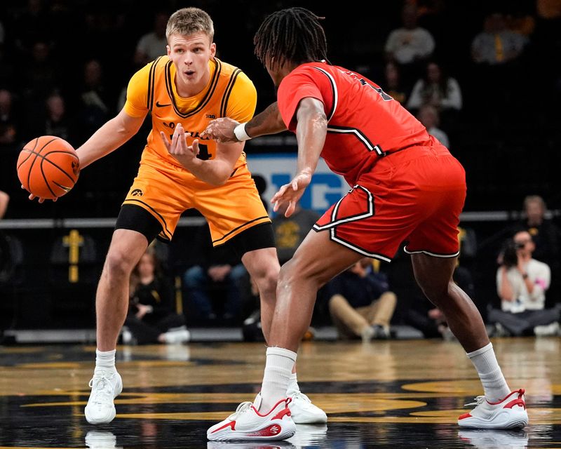 Iowa guard Bennett Stirtz (14) sets up the offense against the Southeast Missouri Red Hawks Nov. 18, 2025 at Carver-Hawkeye Arena in Iowa City, Iowa.