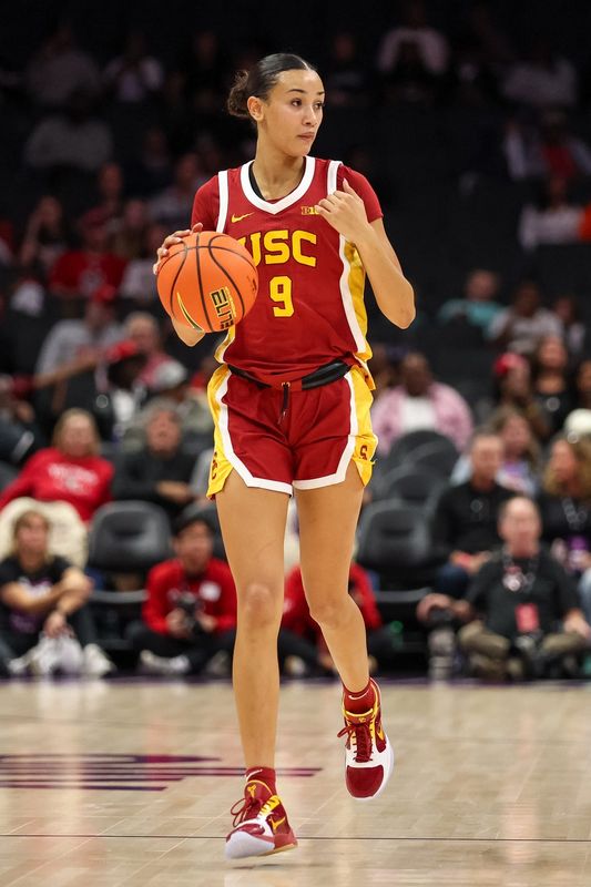 Nov 9, 2025; Charlotte, North Carolina, USA; Southern California Trojans guard Jazzy Davidson (9) dribbles the ball against the NC State Wolfpack during the third quarter of the Ally Tipoff game at Spectrum Center. Mandatory Credit: Cory Knowlton-Imagn Images