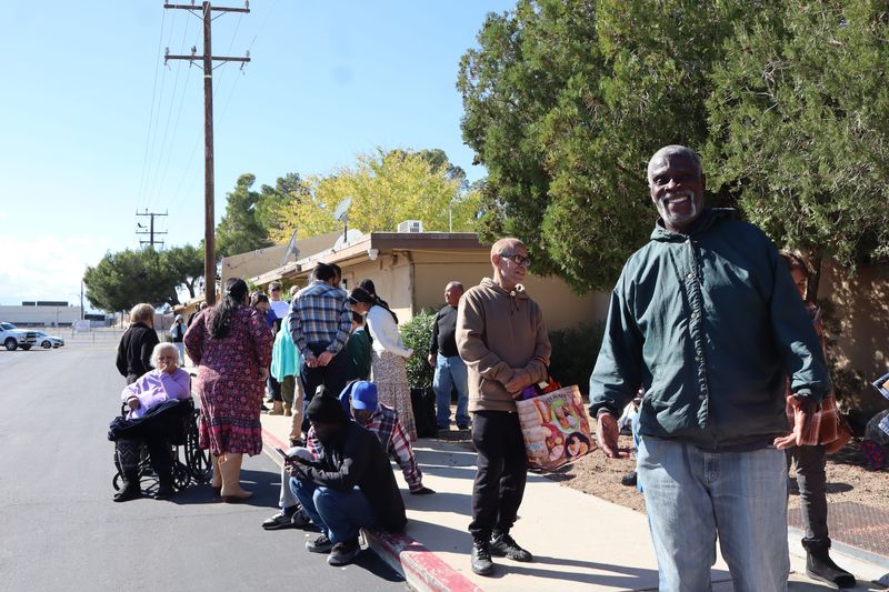 Victorville resident Philip Boston, in the green jacket, says he is grateful that High Desert Second Chance hosted its free Thanksgiving dinner for residents who were impacted by the government shutdown this year, like him.