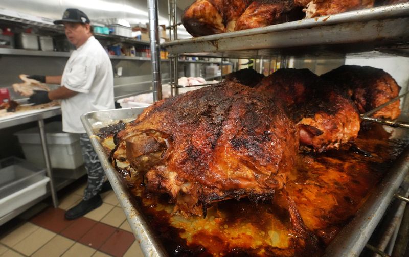 Chef Richard Varble, who has cooked the annual Thanksgiving banquet at the Ventura County Rescue Mission in Oxnard for the past 18 years, tastes some of the turkeys prepared the morning of Nov. 20, 2025. The mission hosted its annual Thanksgiving banquet on Nov. 26.