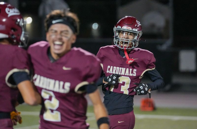 Santa Paula players Dominic Meza (2) and Ethan Meza celebrate after the Cardinals defeated Bellflower 17-14 in a CIF-Southern Section Division 12 semifinal game on Friday, Nov. 21, 2025, at Jones Field in Santa Paula.
