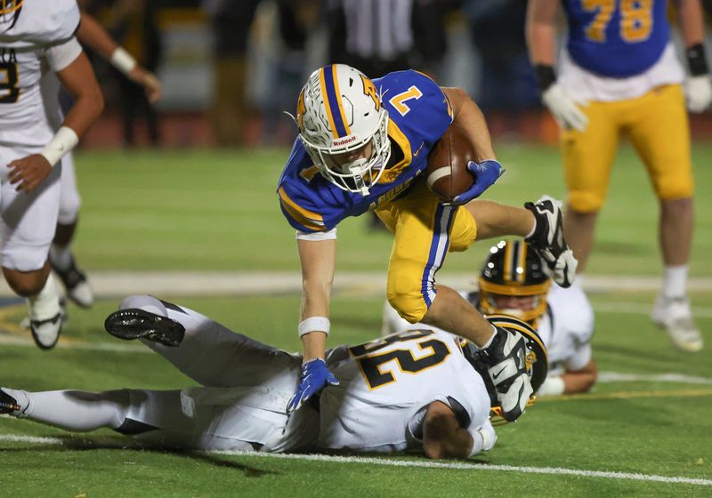 Agoura's George Hastings leaps over Ventura's Landen Alexander for some extra yardage during the third quarter of a CIF-Southern Section Division 6 semifinal game on Friday, Nov. 21, 2025, at Agoura High. Ventura won 28-14.
