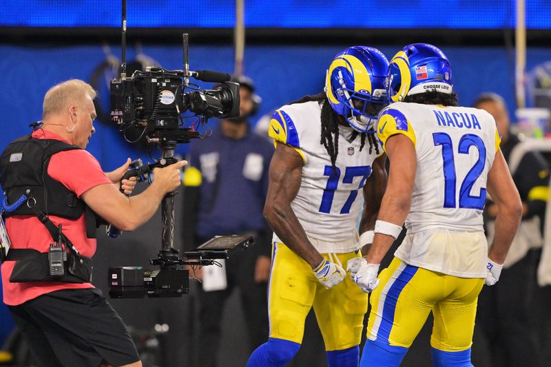 Nov 23, 2025; Inglewood, California, USA; Los Angeles Rams wide receiver Davante Adams (17) celebrates with wide receiver Puka Nacua (12) after scoring a touchdown against the Tampa Bay Buccaneers during the second quarter at SoFi Stadium. Mandatory Credit: Jayne Kamin-Oncea-Imagn Images