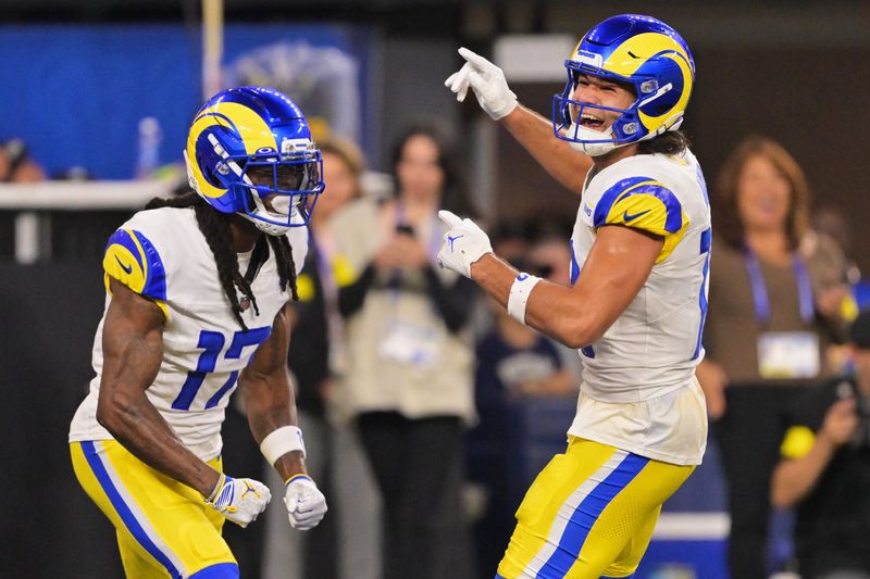 Nov 23, 2025; Inglewood, California, USA; Los Angeles Rams wide receiver Puka Nacua (12) celebrates with wide receiver Davante Adams (17) after Adams scored a touchdown against the Tampa Bay Buccaneers during the second quarter Mandatory Credit: Jayne Kamin-Oncea-Imagn Images