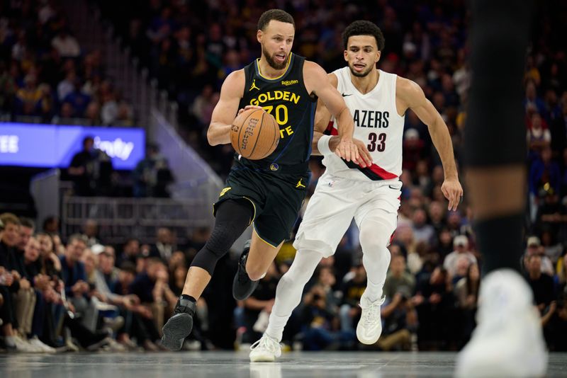 Nov 21, 2025; San Francisco, California, USA; Golden State Warriors guard Stephen Curry (30) drives to the basket wearing Li Ning Jimmy Butler 4 (JB4) Black Knight shoes against Portland Trail Blazers forward Toumani Camara (33) during the fourth quarter at Chase Center. Mandatory Credit: Robert Edwards-Imagn Images