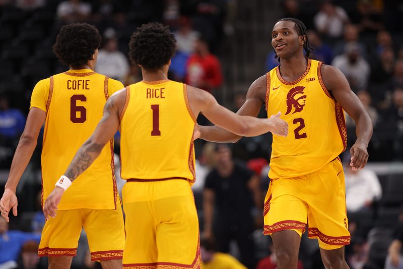 Nov 14, 2025; Inglewood, California, USA; Southern California Trojans forward Ezra Ausar (2) is greeted by forward Jacob Cofie (6) and guard Rodney Rice (1) during the second half of the Hall of Fame Series game against the Illinois State Redbirds at Intuit Dome. Mandatory Credit: Kiyoshi Mio-Imagn Images