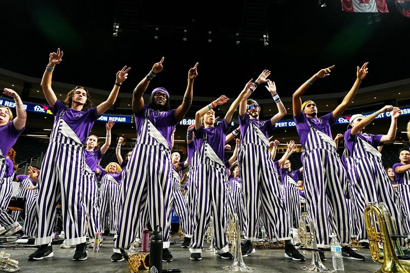 Grand Canyon University marching band members dance prior to the start an Acrisure Series championship basketball game against Iowa at Acrisure Arena in Palm Desert, Calif., on Nov. 26, 2025.