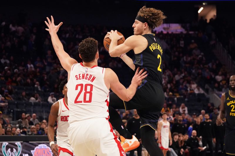 Nov 26, 2025; San Francisco, California, USA; Golden State Warriors guard Brandin Podziemski (2) looks to pass against Houston Rockets center Alperen Sengun (28) in the fourth quarter at Chase Center. Mandatory Credit: David Gonzales-Imagn Images