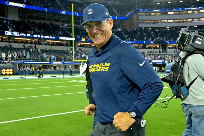 Oct 23, 2025; Inglewood, California, USA; Los Angeles Chargers head coach Jim Harbaugh smiles as he leaves the field following the game against the Minnesota Vikings at SoFi Stadium. Mandatory Credit: Jayne Kamin-Oncea-Imagn Images